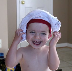 Hamming it up while showing off his post-Glenn scar at age three